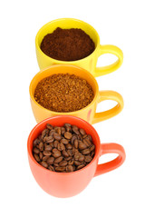 Different types of coffee in three cups isolated on white