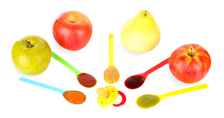 Baby puree in spoons with nipple and fruits isolated on white