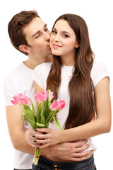 Loving couple with tulips isolated on white