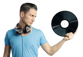 Young male holding black vinyl in hand
