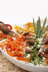 grilled pork with mashrooms and vegetable salad together with pa