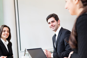 Happy business man smiling at the office