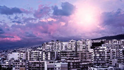 Purple sunset over city