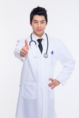 Young Asian doctor showing thumb