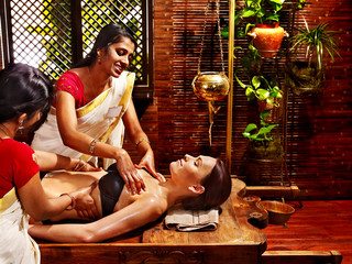 Woman having Ayurvedic spa treatment.