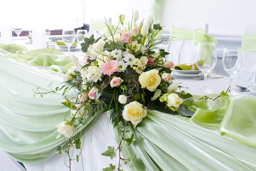table set for wedding dinner decorated with flowers