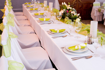 table set for wedding dinner decorated with flowers