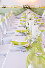 luxury place setting, green napkin on plate