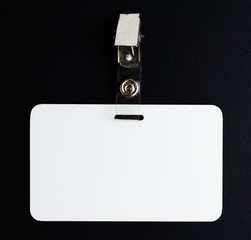 blank white id card on black background