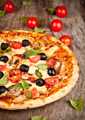 Delicious italian pizza served on wooden table
