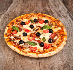 Delicious italian pizza served on wooden table