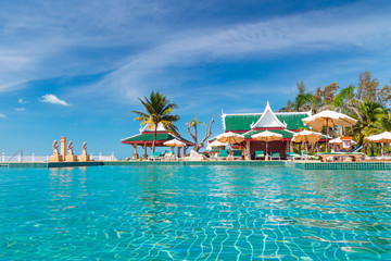 Tropical holidays at swimming pool in Thailand