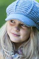 Blond girl with cap