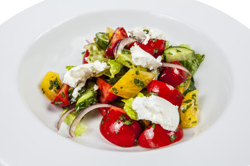 Greek salad on white isolated background