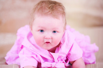 Cute baby in pink dress