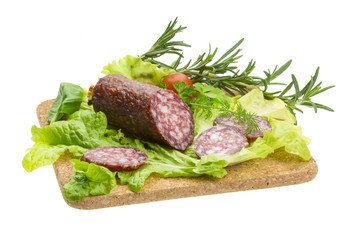 Salami with rosemary, salad and tomatoes