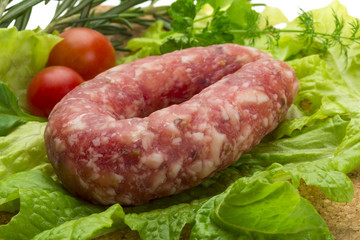 Salami with rosemary, salad and tomatoes