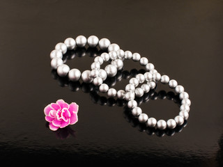 pearl bracelets on a black background