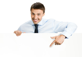 Businessman showing signboard, on white