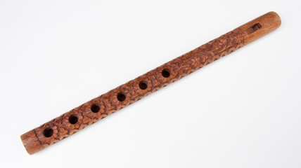 Ornately carved wooden flute