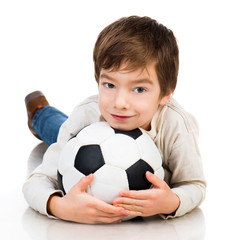 Little boy playing soccer ball