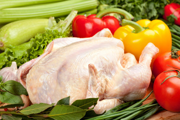 Fresh raw chicken and vegetables