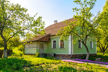 Fototapeta na wymiar A typical green Ukrainian house, in the countryside near Kiev 