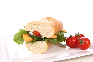 Sandwich with cheese, cucumber, tomato and lettuce