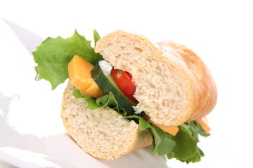 Sandwich with cheese, cucumber, tomato and lettuce
