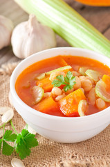 Tomato soup with pumpkin, beans and celery