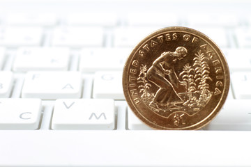 A coin on a laptop keyboard