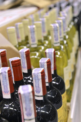 Red and white wine in bottles