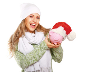 Young beautiful woman with piggy bank