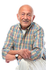 Portrait of a happy senior man smiling isolated on white