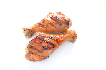 Grilled chicken leg on white background.
