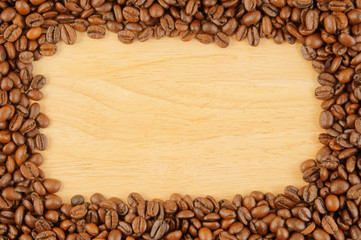 Coffee beans on wooden background