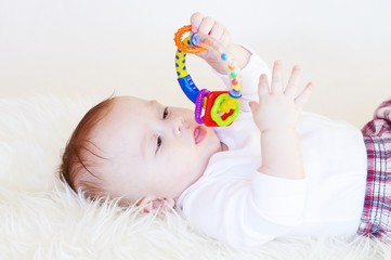 The baby with a rattle