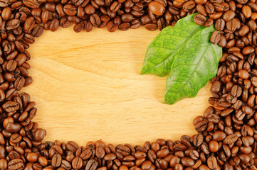 Coffee beans on wooden background