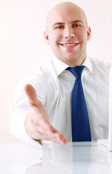 Young businessman  with open hand