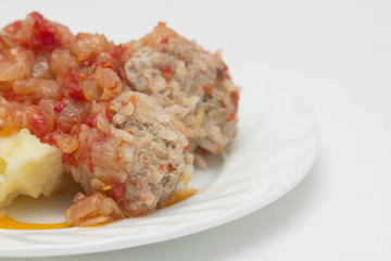 cutlet with potatoes in tomato sauce