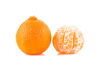 Peeled and unpeeled tangerines isolated over white background