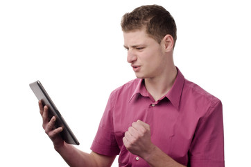 Man not happy while watching something on the tablet.