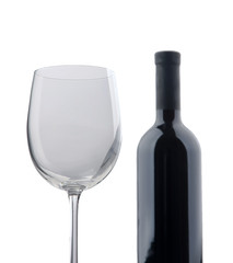 An empty wine glass and a bottle , isolated on white background