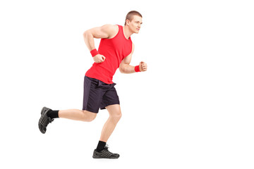 Full length portrait of a fit muscular male athlete running