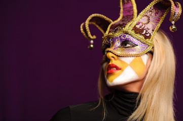 woman in violet carnival mask