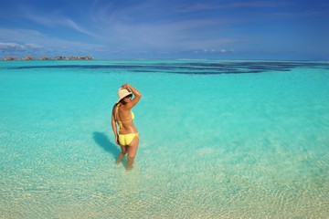 beautiful  woman resting on tropical  beach