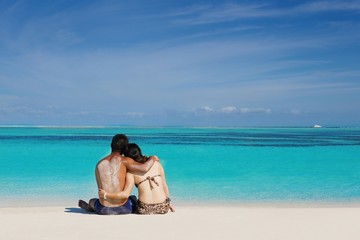 happy young  couple enjoying summer on beach