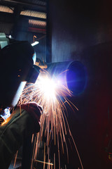 welders are working in the factory