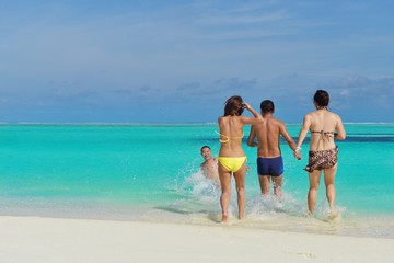 Fototapeta premium group of happy young people have fun on bach