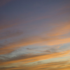Fototapeta na wymiar Blue sky and orange clouds